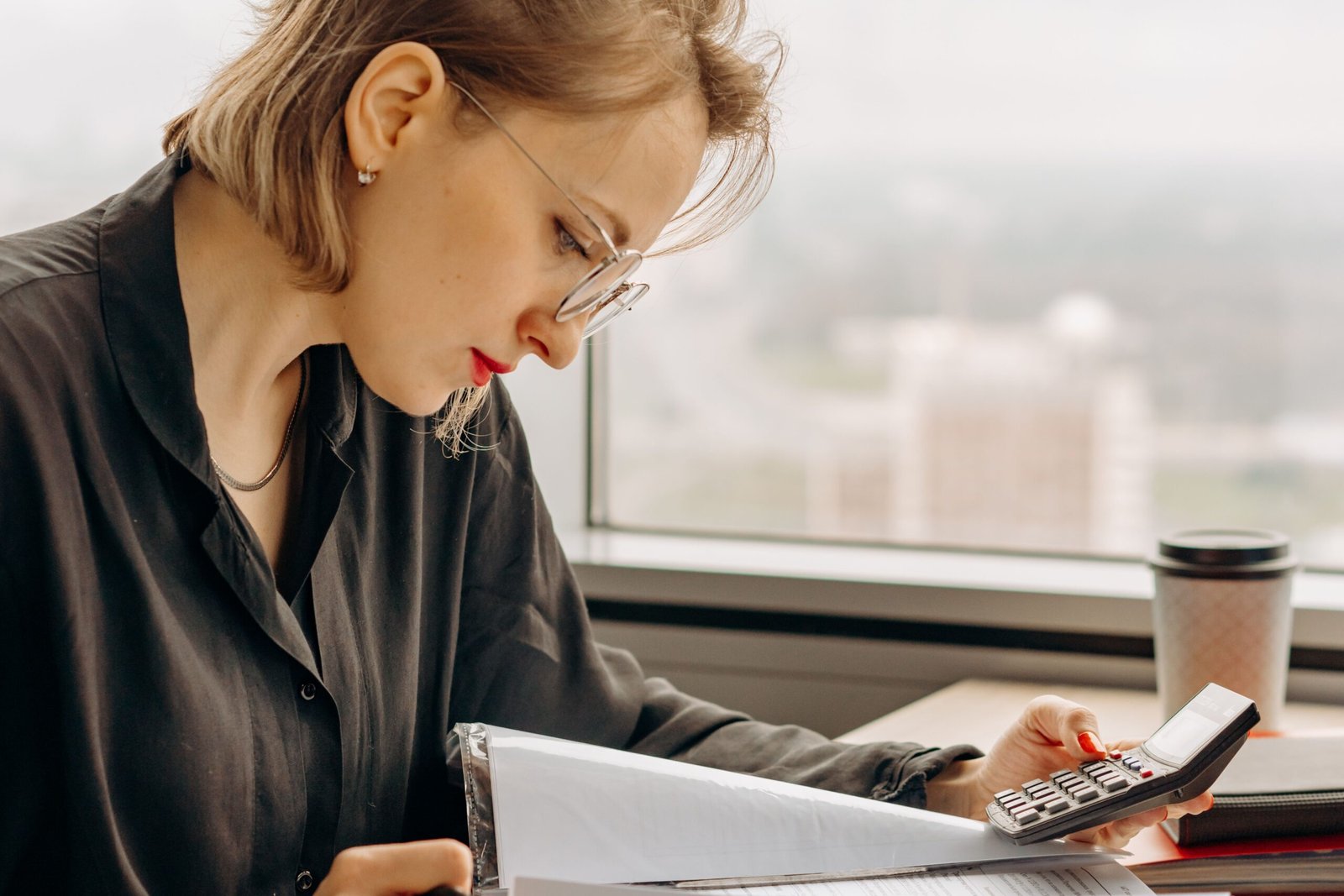 Woman setting financial goals and reviewing her budget